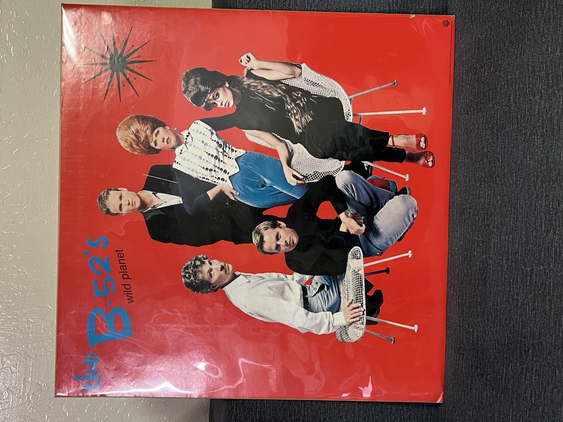 The B-52â€™s Wild Planet 1980 Warner Brothers Records Promotional Poster: The B-52â€™s Wild Planet 1980 Warner Brothers Records Promotional PosterVibrant red background and clear image Small rip by the right lower bottom edge Bottom left and right corner has small ding
