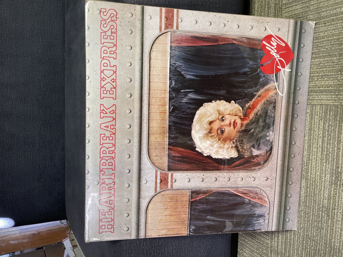 Dolly Parton â€œHeartbreak Express” promo poster: Cool poster. Great image of Dolly. Corner dings as noted in pictures. Measures 22.5 x 22.5”.