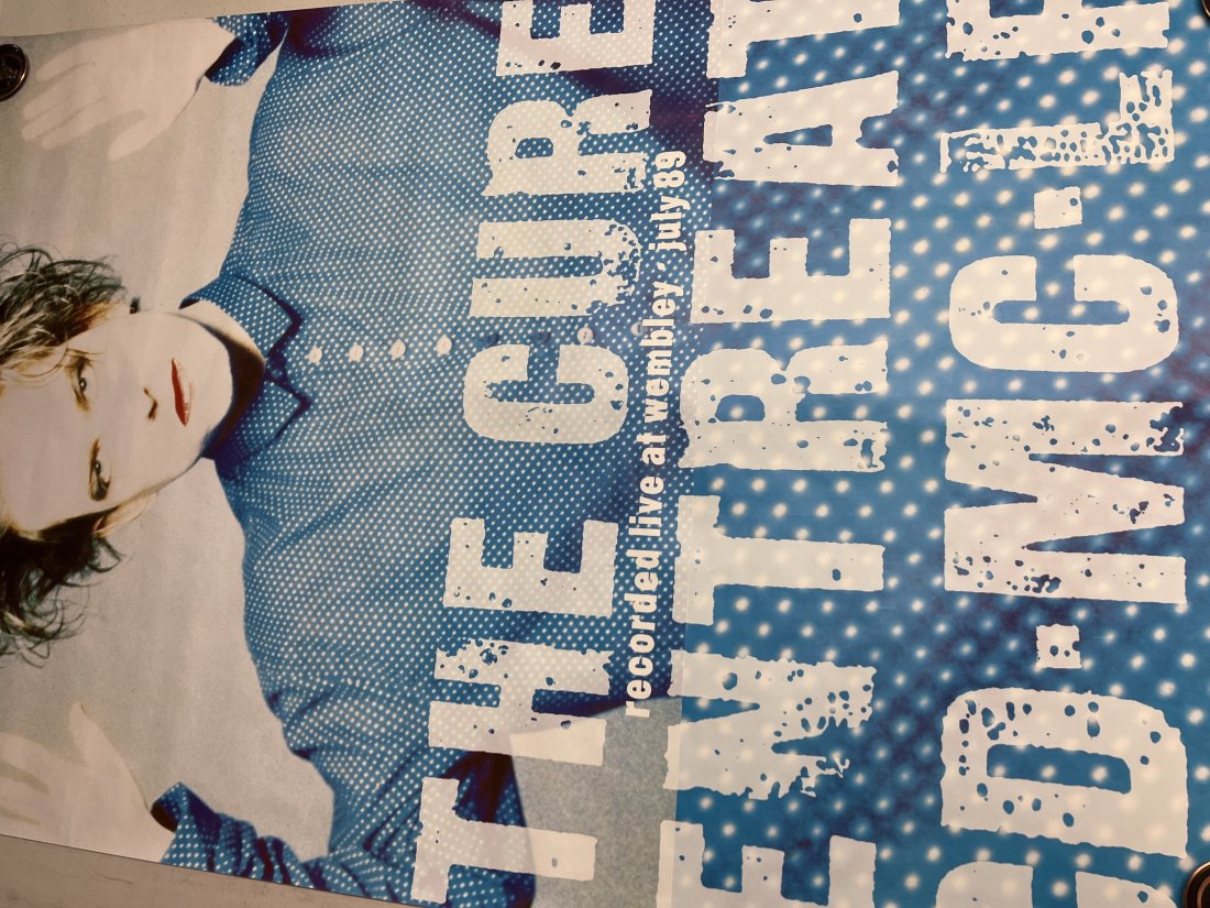 The Cure Recorded Live At Wembley July 1989 Album Promo Poster: Poster may show minimal damages such as cornerwear, edgewear as shown in photos. Posters may also show crease marks due to prior forms of storage. Measurements: 60” x 40”