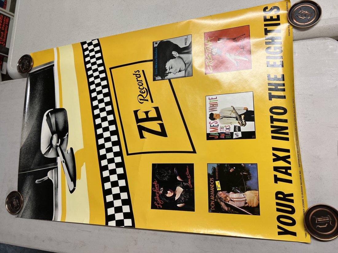 ZE Records Your Taxi Into The Eighties 1980 Music Promo: Poster may show minimal damages such as cornerwear, edgewear as shown in photos. Posters may also show crease marks due to prior forms of storage. Measurements: 36” x 24”