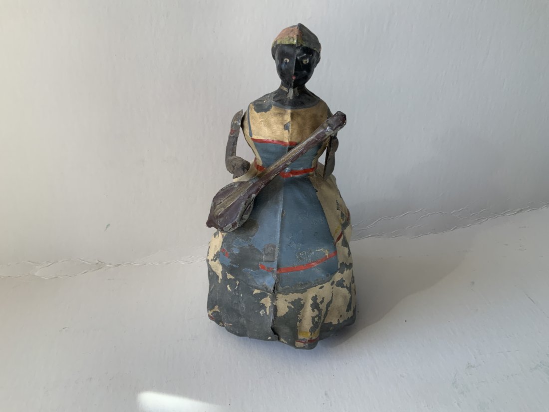 Early Antique black Americana tin wind up noise making wind up toy figure playing banjo: Very rare. Works very well. Measures 7.5 inches tall. No makers mark. Early toy. Paint loss. Very seldom seen. Please examine photos carefully in order to determine the condition of the item. Photos a