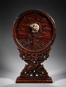 In the Qing Dynasty, yellow rosewood inlaid with Hotan jade bird screen