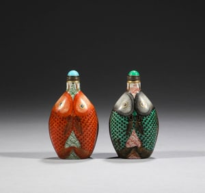 In the Qing Dynasty, a pair of pink painted double fish snuff bottles