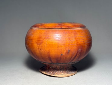 Tang Dynasty yellow glazed high footed jar