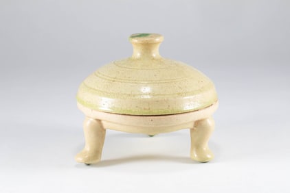 Tang Dynasty yellow glazed three legged inkstone
