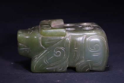 Round carved jade ox