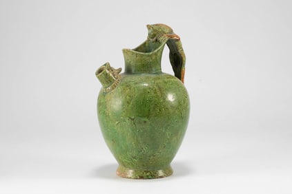In the Tang Dynasty, a dragon handle was used to hold a pot with a twisted fetus