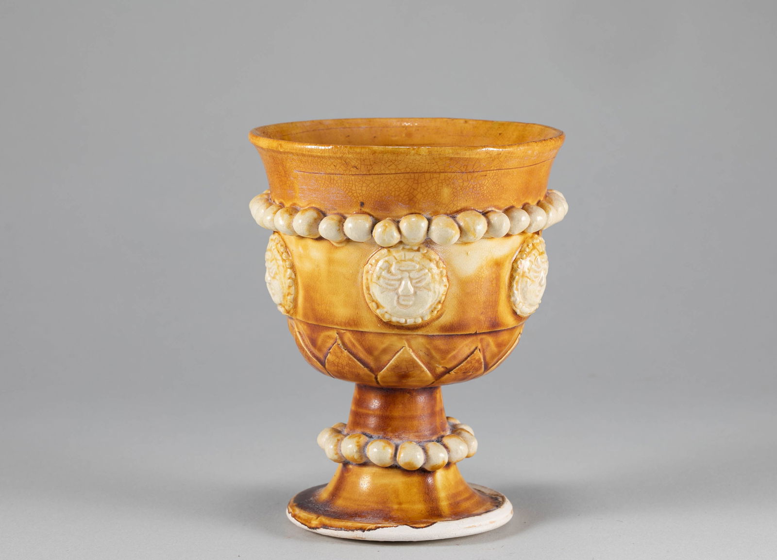 Tang Dynasty yellow glazed high footed cup: H:11.2cm D:9cm