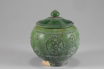 Tang Dynasty green glazed milk nail patterned lid jar