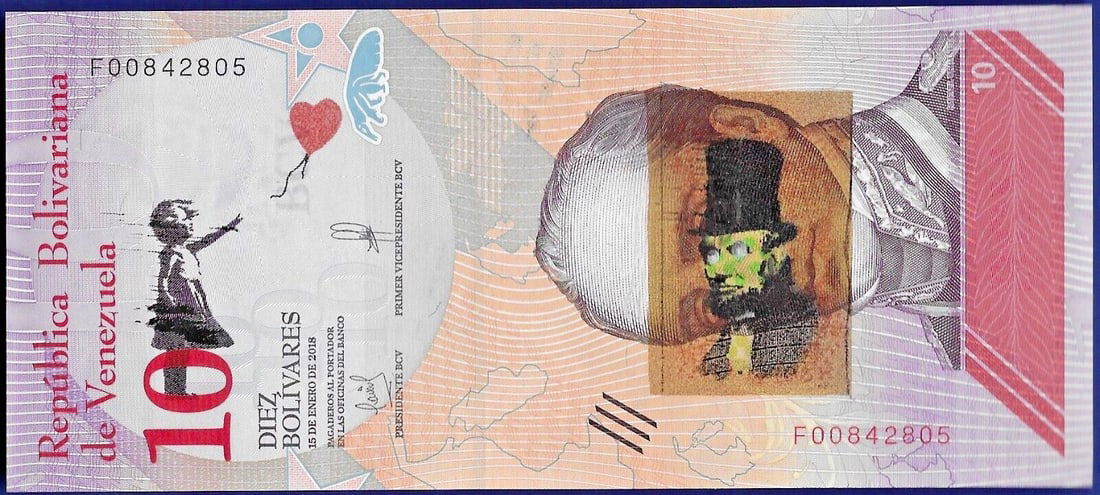 Banksy - Banknote 10 Bolivares with artist's stamp Dismaland 2015 in Acrylblock Frame: Banksy. Banknote 10 Bolivares with artist's stamp Dismaland 2015, is framed in a 20 mm-thick magnetic acrylic block frame, which will allow you to display and admire both sides of the work. The frame