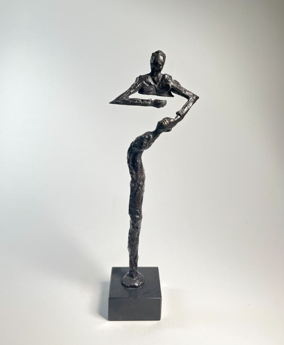 Klaas van den Berg - Bronze Sculpture, The Supportive Man: The Supportive Man, Klaas van den Berg – A bronze sculpture, 33 × 10 × 6.5 cm, mounted on a square stone base. The elongated figure reaches forward in a gesture of openness and strength, its