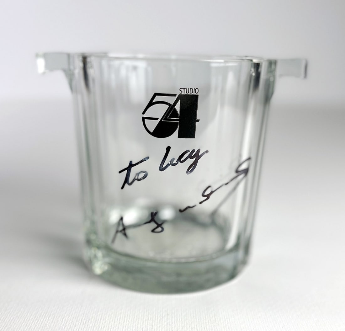 Andy Warhol - Glass ice bucket cooler of Cointreau - 54r - Studio 54 - Hand signed: Artist: Warhol, Andy Title: Glass ice bucket cooler of Cointreau Technique: Marker drawing on Glass size: 13,3 x 16,5 cm. (5,25 x 6,5 inch) Framed: Not framed More Information