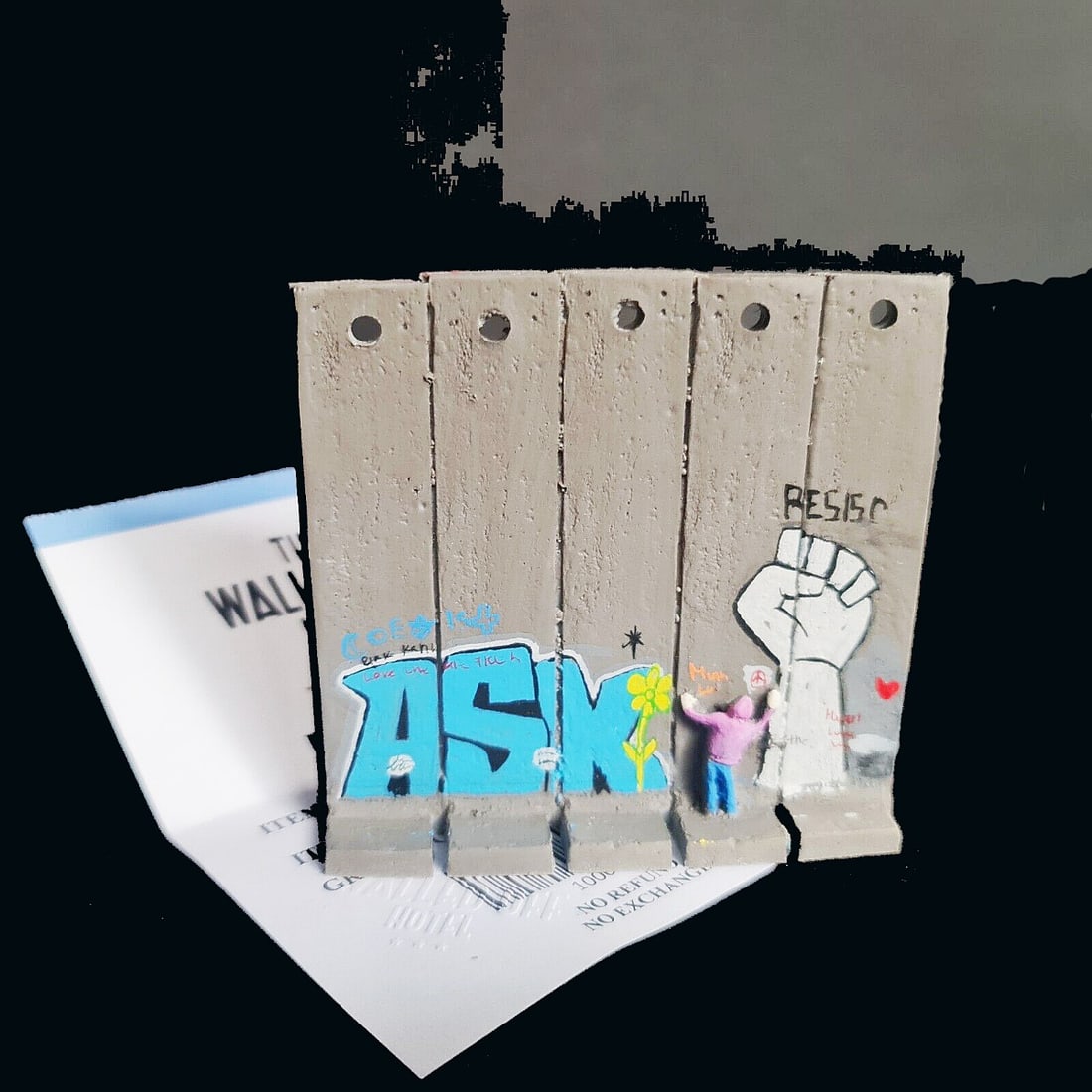Banksy - Walled Off Hotel -Sculpture - Ask - receipt included: Artist: Banksy Title: Banksy Walled Off Hotel - Wall Sculpture - Ask Technique: Sculpture on Multimedia size: 9,5 x 9,5 cm. (3,75 x 3,75 inch) Framed: Not framed More Information BANKSY Sculpture
