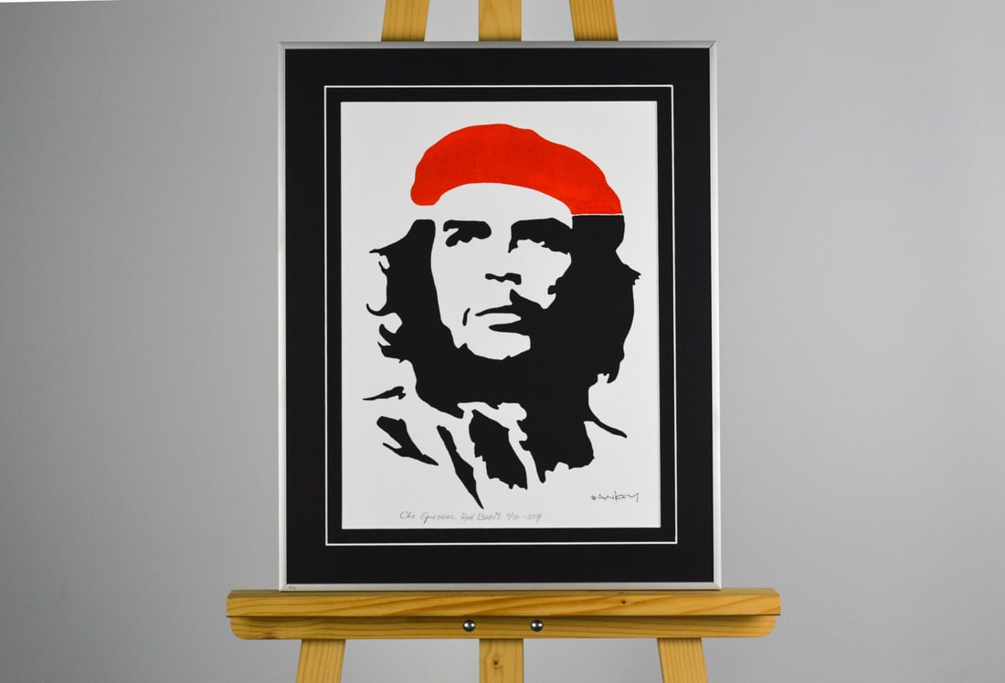 Street Artist. Stencil/Spray: Artist: Banksy, after Title: Che Guevara Red Baret Technique: Stencil/Spray on Handmade paper size: 40 x 30 cm. (15,75 x 11,8 inch) Framed: 50,5 x 40,5 cm. (19,9 x 15,95 inch) More Information
