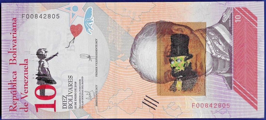 Banksy - Banknote 10 Bolivares with artist's stamp Dismaland 2015 in Acrylblock Frame: Artist: Banksy Title: Banknote 10 Bolivares with artist's stamp Dismaland 2015 Technique: Banknote on Acrylblock Frame size: 7,3 x 15,8 cm. (2,85 x 6,2 inch) Framed: 12,7 x 20,3 cm. (5 x 8