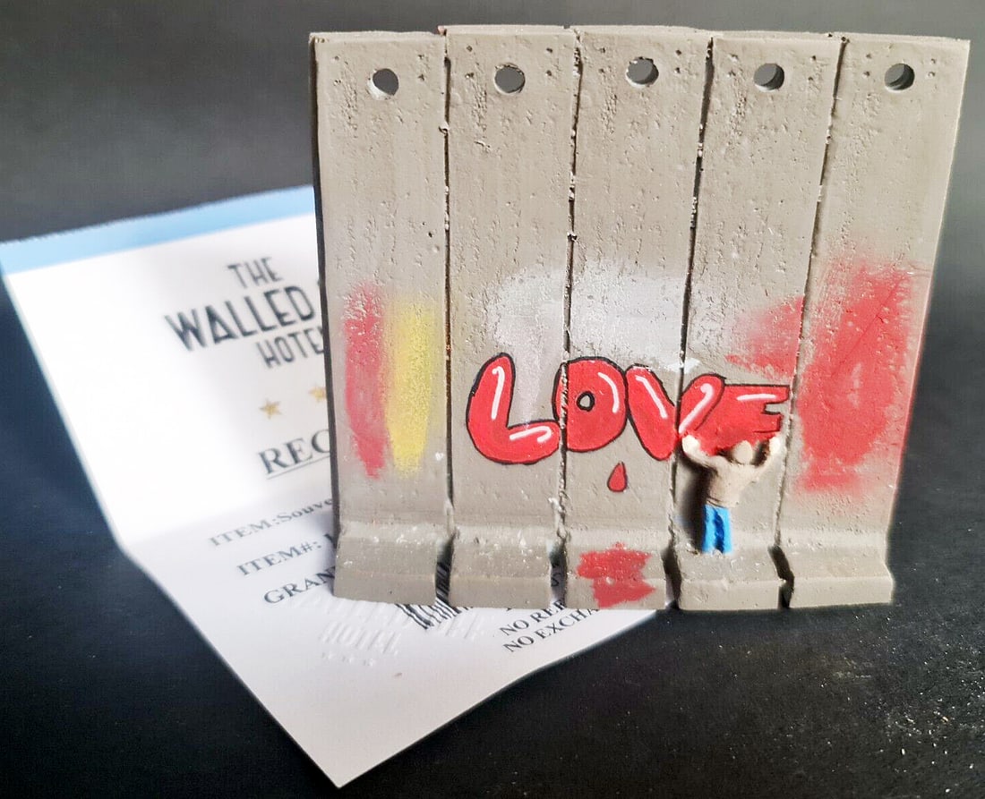 Banksy - Walled Off Hotel -Sculpture - Love - receipt included: Artist: Banksy Title: Banksy Walled Off Hotel - Wall Sculpture - Love Technique: Sculpture on Multimedia size: 9,5 x 9,5 cm. (3,75 x 3,75 inch) Framed: Not framed More Information BANKSY Sculpture