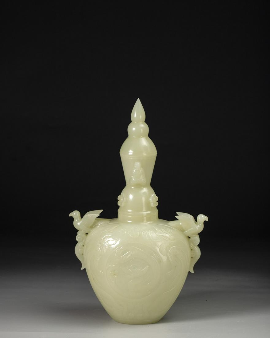 A CARVED WHITE JADE BOTTLE (1 of 11)