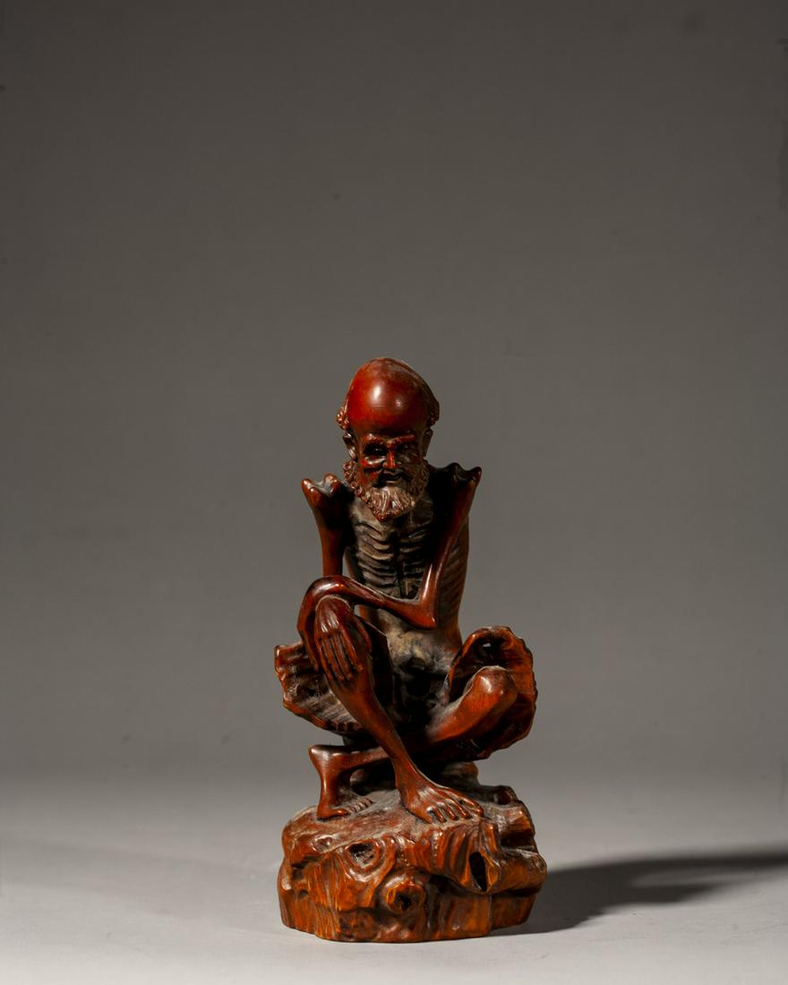 A CHINESE CARVED BOXWOOD FIGURE OF LUOHAN, QING DYNASTY (1 of 7)