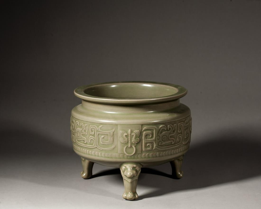 A CHINESE YUEYAO CELADON-GLAZED TRIPOD CENSER, FIVE DYNASTIES (1 of 7)