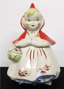 Rare Hull Pottery Little Red Riding Hood Cookie Jar Poinsettia's: Little Red Riding Hood Cookie Jar by Hull Regal China. Rare Poinsettia's decoration on her skirt. No chips/damage, small rub on the black cold paint of her feet. Bright, colorful & cheerful one of the