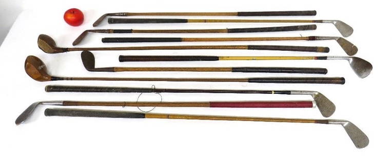 11 Antique Hickory Shaft & Wood Grain Golf Clubs/Drivers: Lot of early golf clubs, some with hickory shafts, others metal woodgrained, MacGregor, Spalding, Cruikshank, Scotland etc. Some oxidation in spots, overall decent group nice decorator lot