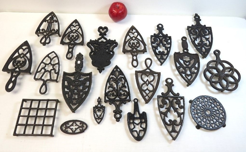 A group of 19 Cast Iron Sad Iron Trivets Late 19th/Early 20th C. (1 of 9)