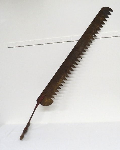A Hudson River Ice Saw: Early Hudson River ice harvesting saw in old red paint. 69" long overall