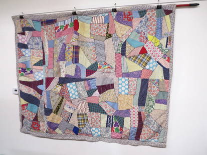 Hand stitched Crazy Quilt: Hand stitched crazy quilt, approximately 78" long and 66" wide, crazy quilt top and calico flower print back, good condition, no rips/tears or odors. Reverse side is an overall purple violets pattern.