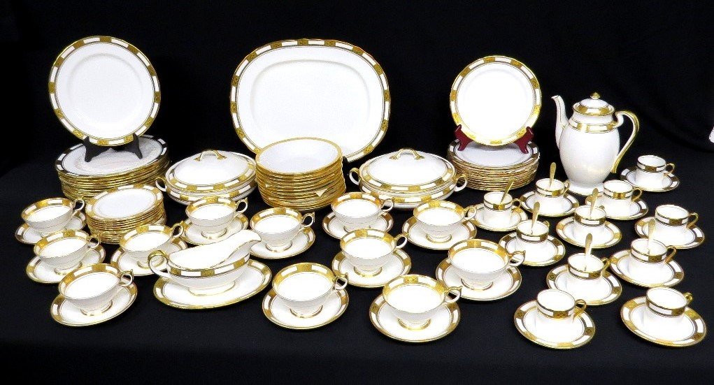 A 12 Place Setting of Aynsley Bone China Empress White & Gold Dinner China 76pcs: A beautiful set of Aynsley Bone China in a pattern called Empress white, with gold trim. From a Dutchess County estate. Set consists of 1 Platter (15"), 12 Dinners (10.5"), 12 Salads (8"), 12 Breads (