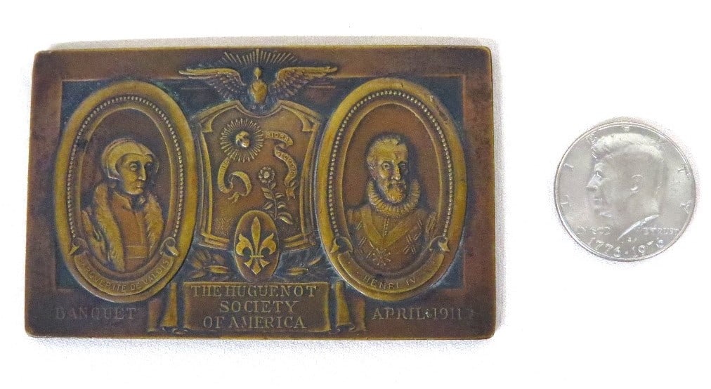 Huguenot Society of America, 1911 Banquet Paperweight: A bronze paperweight commemorating the Huguenot Society of America's April, 1911 Banquet. Quite possibly from Ulster County which had an active Huguenot Society Chapter in New Paltz, NY. Coin is for s
