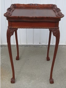 A Carved Walnut Finish Openwork Table, In The Manner Of Flint & Horner.