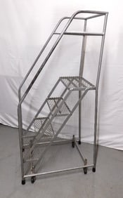 A Vintage Industrial Warehouse/Library Rolling Staircase