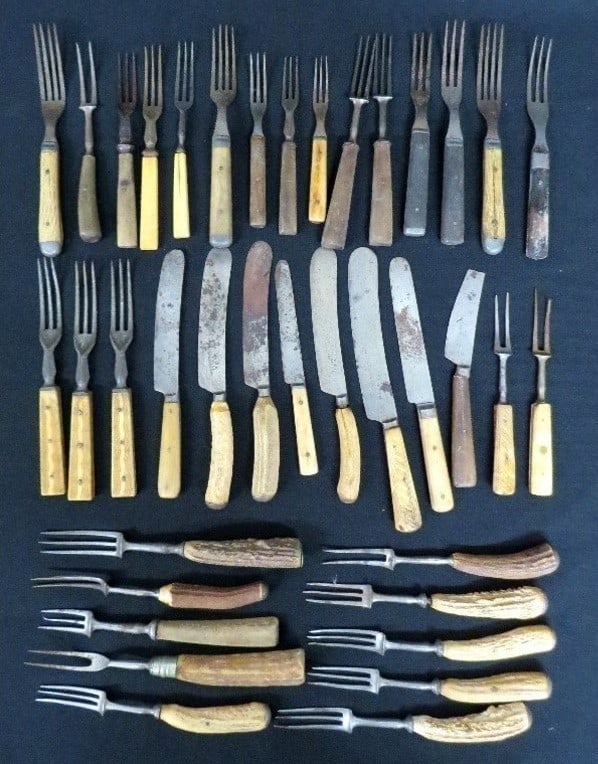 38pc Lot of Early - Mid 19th C. Cutlery, Knives & Forks: An exceptional group of early to mid 19th C. tableware or cutlery c.1830's-80's era, 38 pieces total. Bone & stag antler handles, English Shear Steel knives, many unsigned, generally good condition fo