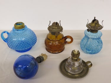 Group of Victorian era colored glass finger oil lamps