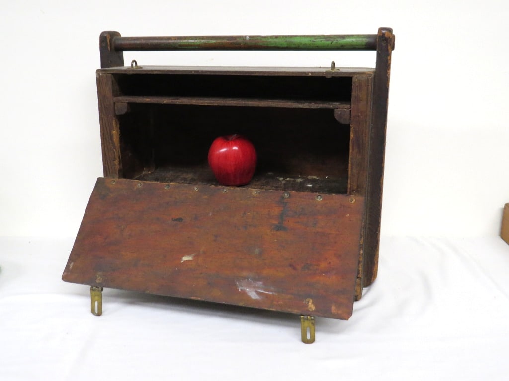 Primitive Traveling Artists Case in old paint: Late 19th/early 20th C. Traveling Artists case with 2 doors, upper compartment & lower on continuos brass hinge. Measures 19" wide, 16" in height to handle and about 7" depth. Old green paint remains