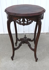 An early 20th C. Flint & Horner Flame Mahogany Top Table
