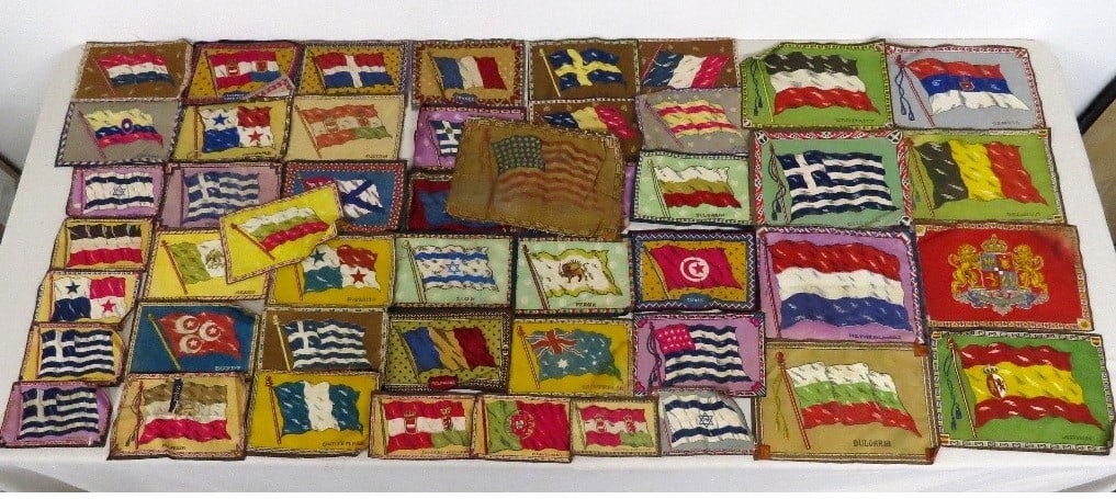 46 Cigar & Cigarette Felts Flags of Many Nations: A mixed group of 46 vintage cigar/cigarette felts featuring flags of many nations, good condition, some countries no longer exists by that name.