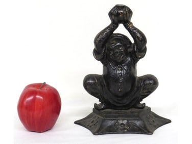 Figural Squatting Man Cast Iron Doorstop