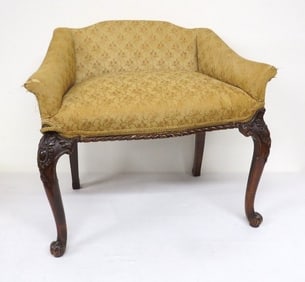 A Carved Mahogany Upholstered Vanity Bench