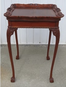 A Carved Walnut Table, In The Manner Of Flint & Horner.