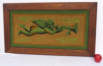 A Trumpeting Angel Framed Hooked Rug