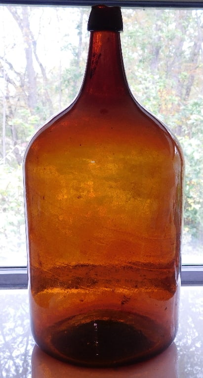 Tangerine Orange Westford Glass Works Demijohn 19th C.: Attributed to Westford glassworks production, with the characteristic slightly flared lip rim and a color that matches some of the GXIII-35 to GXIII-37 flasks that are found. Richly overflowing with s