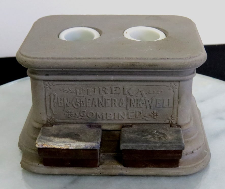 Smith Bros. Mfg Passaic, NJ Gray Basalt Eureka Pen Cleaner Inkwell: A Eureka advertising inkwell by the Smith Brother's of Passaic, NJ in gray basalt with 2 milk glass founts, and two lidded pen cleaners underneath. Late 19th/Early 20th C., likely mounted to a wooden