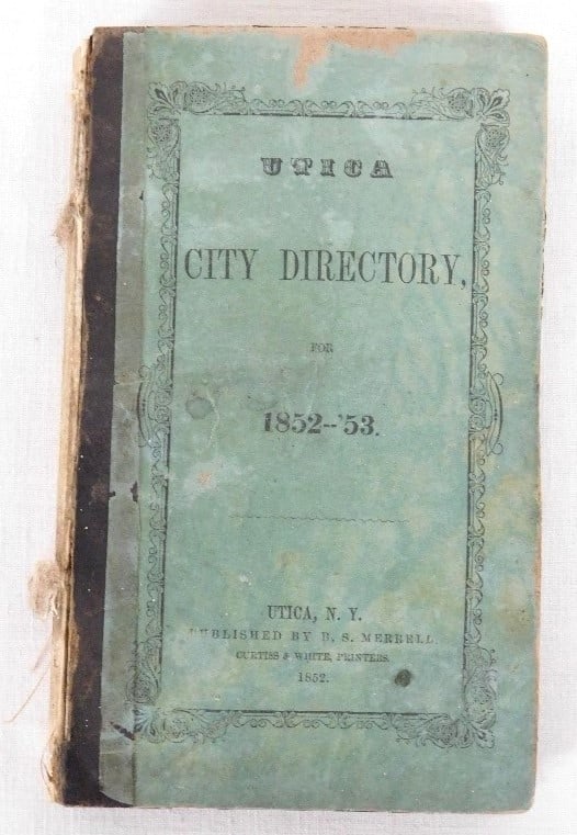 H.S. Merrill's City Directory for Utica, NY 1852-53: H.S. Merrill's City Directory for Utica, NY 1852-53, with 143pgs of listings, and 43pages additional of advertisements!! Measures 4.5" x 7.5" in size. Tattered bindings, but what a trove of historical