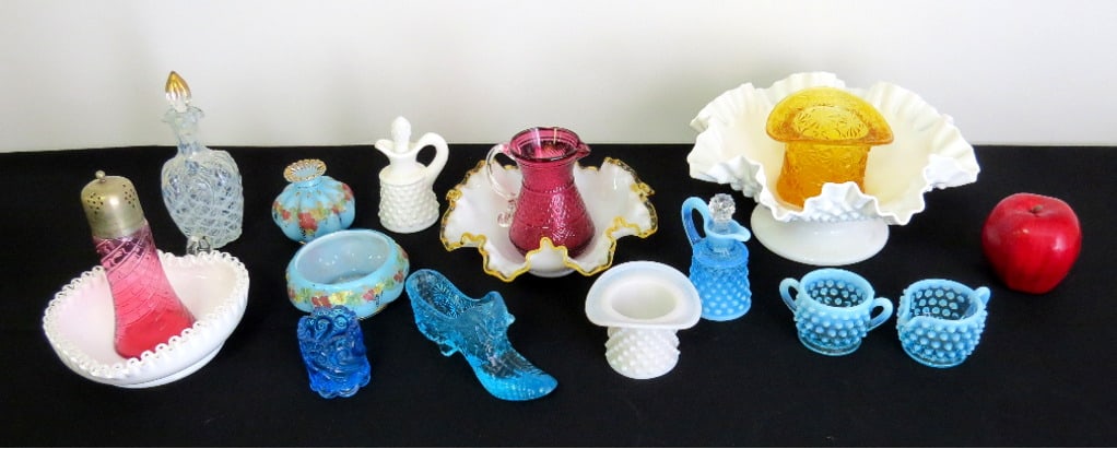 Lot of Early to Mid-Century Fenton Glass: Table lot of primarily Fenton glass including heart shaped amberina ruffled edge bowl, milk glass hobnail console footed bowl, hobnail cream/sugar, shaker & more