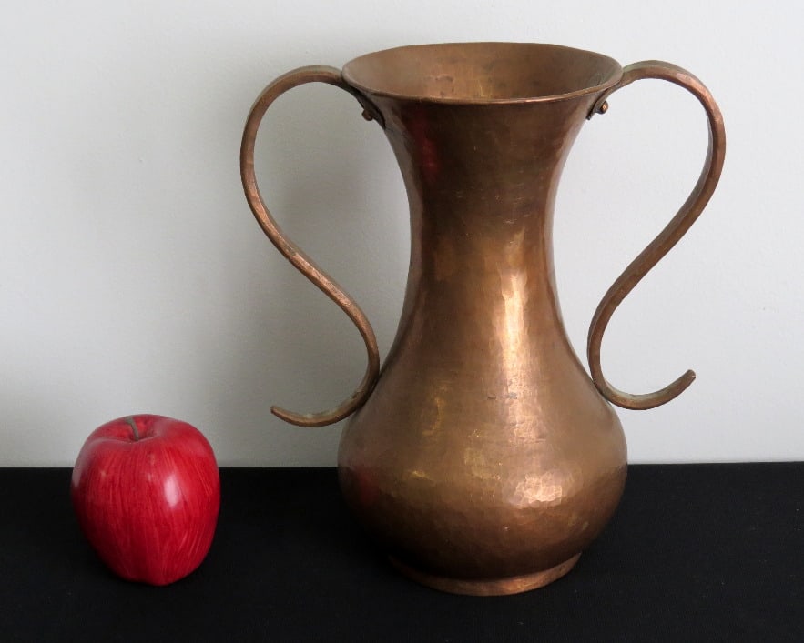 Art Deco Hammered Copper Vase or Urn: A hammered copper vase, unsigned, with an Art Deco flair standing 10.5" in height.