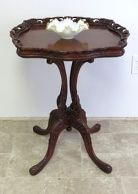 A Carved Mahogany Table In The Manner of Flint & Horner