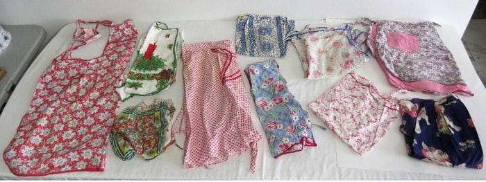 A Table Lot of 10 Vintage Aprons of the 1930's-50's
