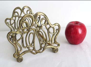 An Art Nouveau Brass Expanding Book Rack
