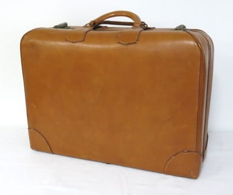 A 1930's Brown Cowhide Leather Travel Suitcase